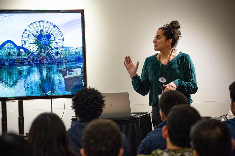 Imagineer giving a presentation to a group.
