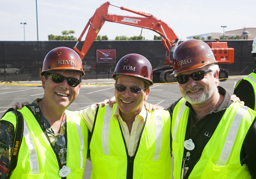 Imagineers smiling on a construction onsite.