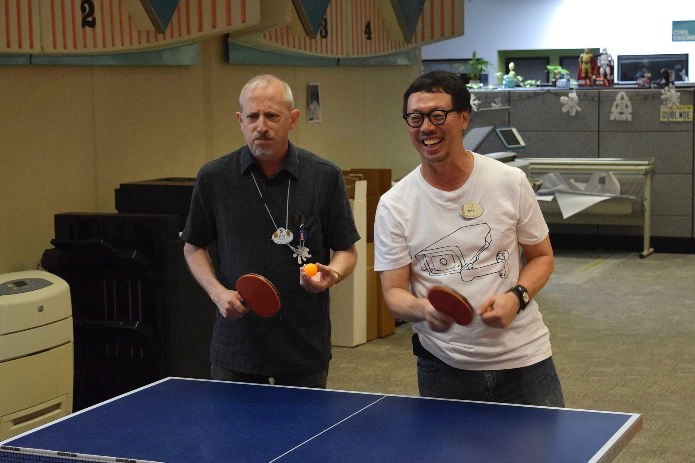 Imagineers playing ping-pong during the annual Walt Disney Imagineering ping pong tournament.