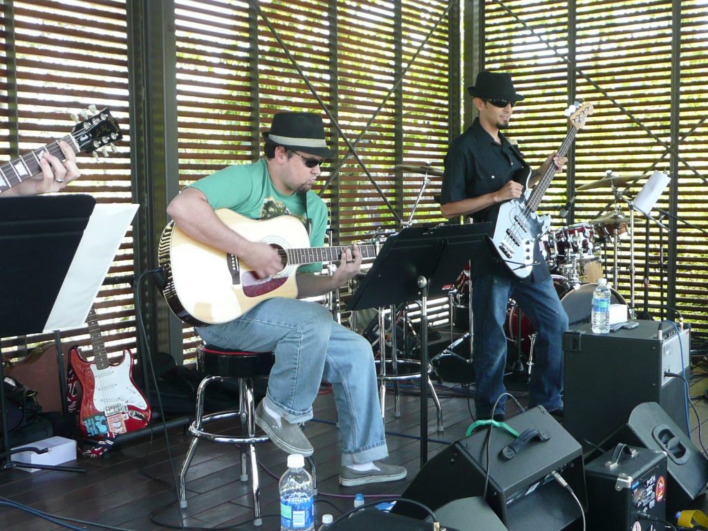 Imagineers playing as a band on the WDI campus.