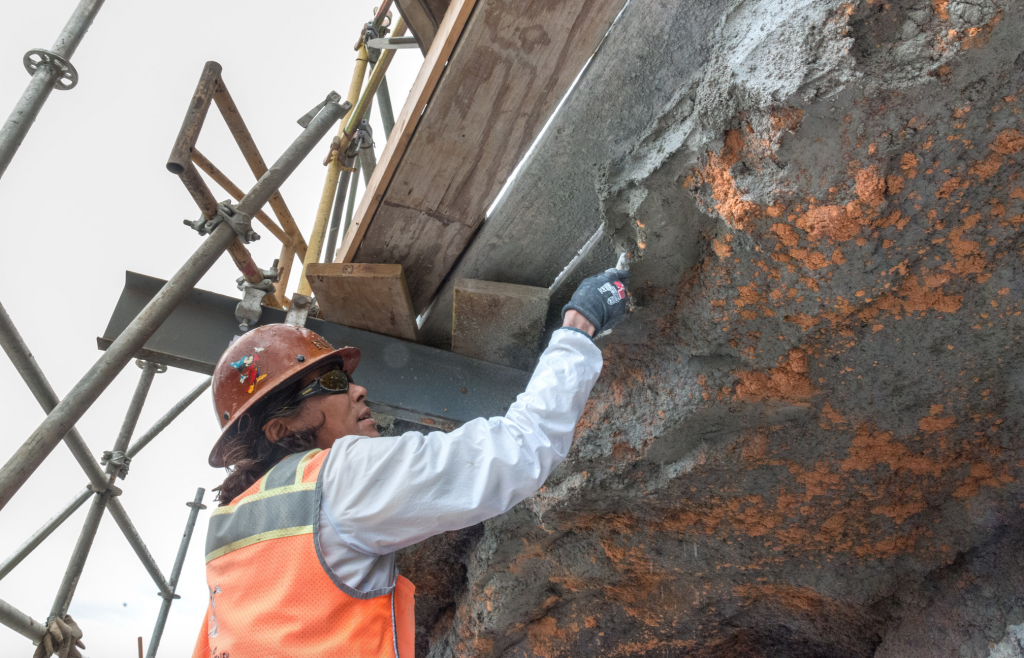 Imagineer working on rock work