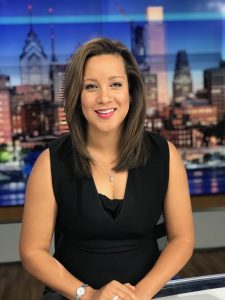 Headshot of women at anchor desk