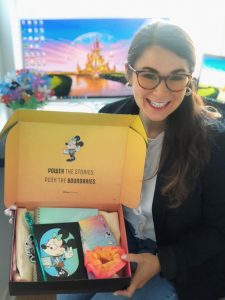 Grace Hopper Conference Attendee Holding Box of Disney Swag