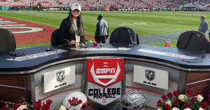 Photo of Sierra Galanza sitting at the commentator desk at the Rose Bowl