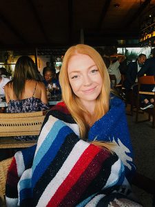 Photo of Madeline Chais at a restaurant 