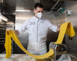 Max preparing to serve memorable meals to guests at Remy onboard the Disney Dream.