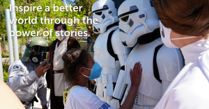 Photo of Star Wars characters and children, text: Inspire a better world through the power of stories.