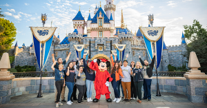 Mickey Mouse in a gap and gown with students and grads from California State University, Fullerton and Fullerton College