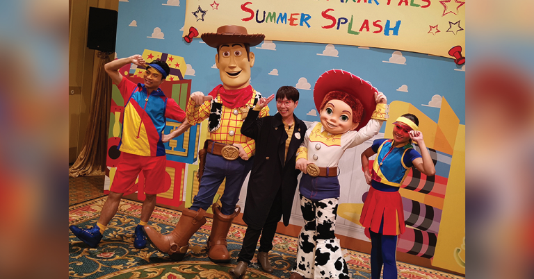Sam Chan with Toy Story characters Woody and Jessie