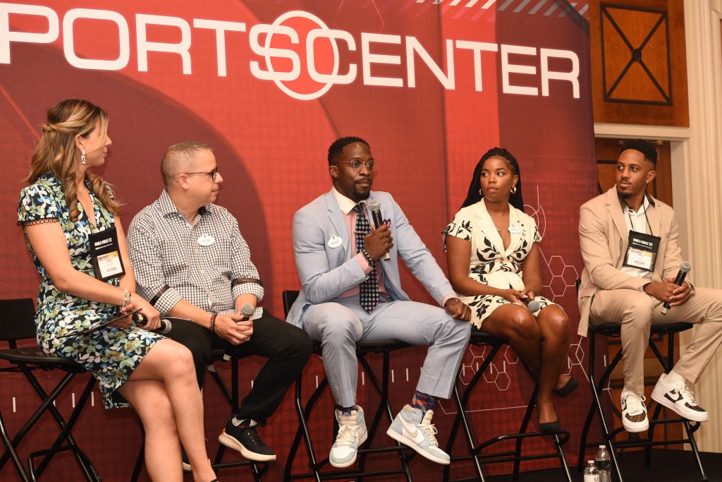 Sportscenter Snapchat anchor Skubie Mageza speaks at an ESPN panel alongside other ESPN employees.