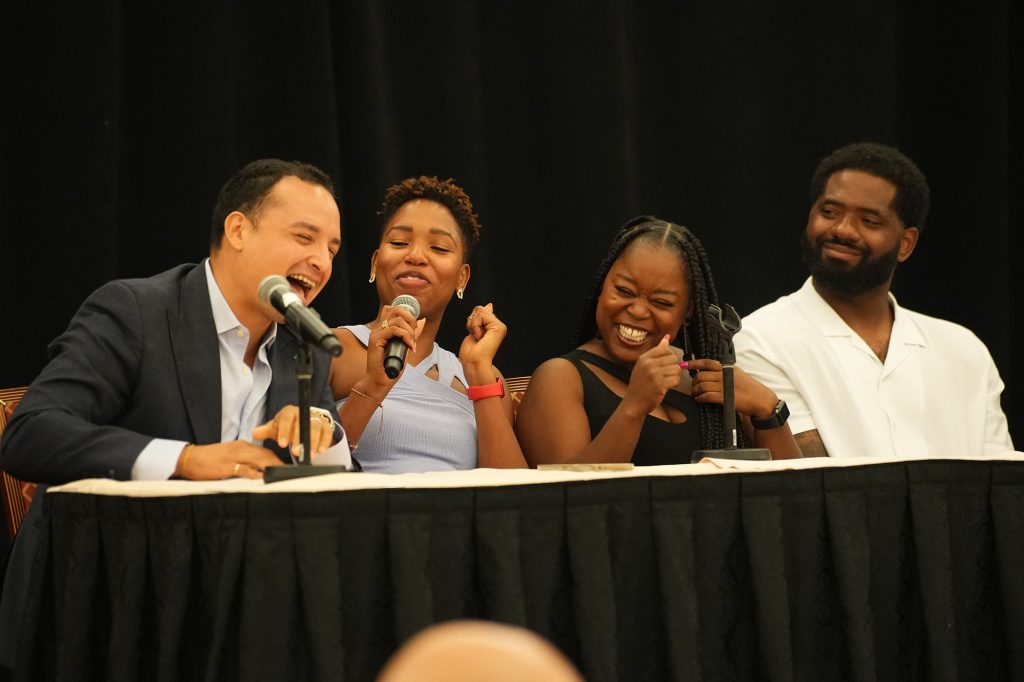 Panelist laugh at a session with The Walt Disney Company employees.