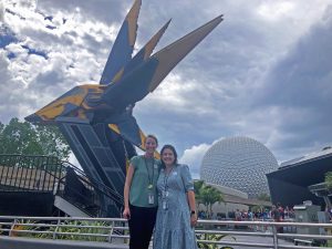 Kennedy and co-worker in front of the Guardian of the Galaxy Cosmic Rewind ride at EPOCT