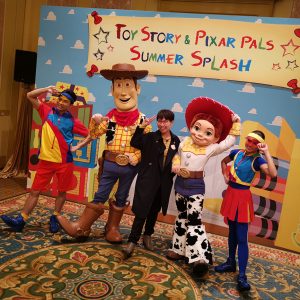 Sam Chan with Toy Story characters Woody and Jessie