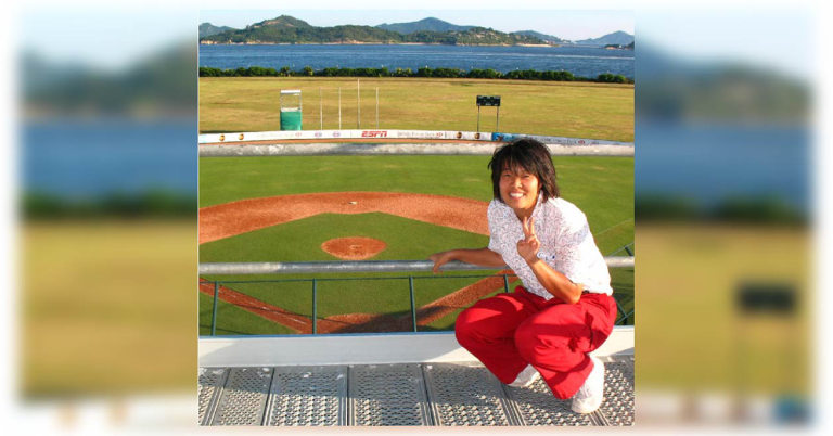Photo of Joan on a baseball field