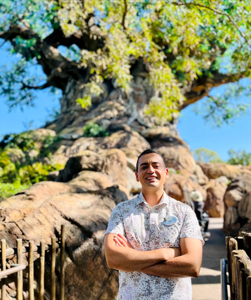 Guest Experience Manager Joe in front of the Tree of Life at Disney's Animal Kingdom Theme Park.