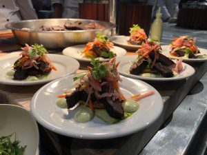 Chef Daniel Contreras' plated dish - Corn Cake Arepa with Chimichurri Skirt Steak, Jicama Slaw and Cilantro Aioli