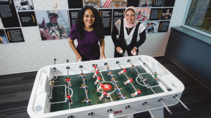 Jomana Ismail and Kruthika N.S. playing foosball