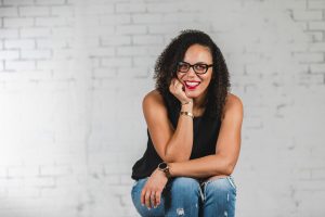 Photo of Tai McEachin in front of a white brick wall