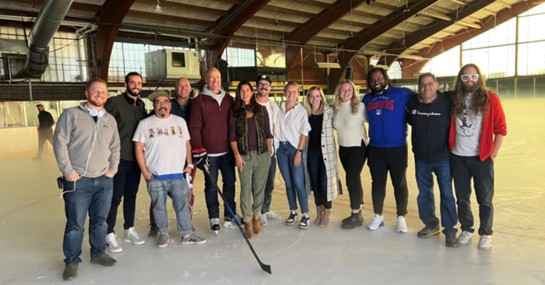 Messier (fifth from left in the group) and the production crew put the shoot on ice.