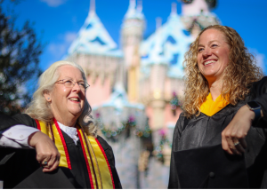 J'Amy and fellow graduate at Disneyland