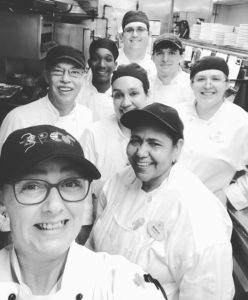 Selfie of Disney culinary Sous Chef Cinderella with her team at EPCOT