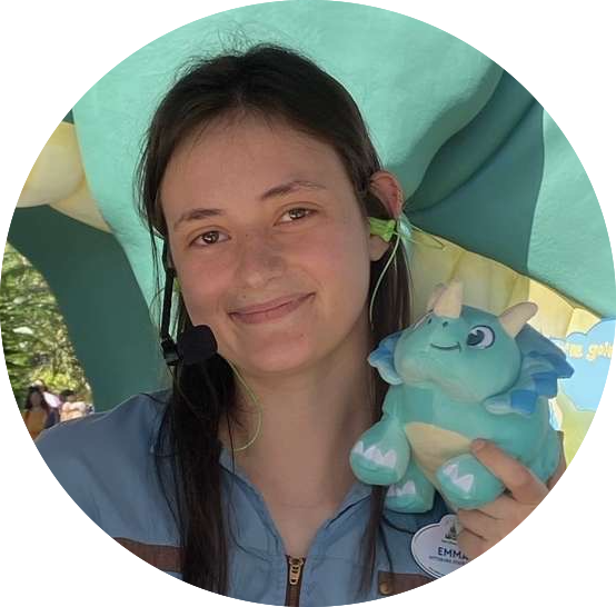 Disney College Program Podcast Mini Series guest Emma smiling while holding a Disney plush toy