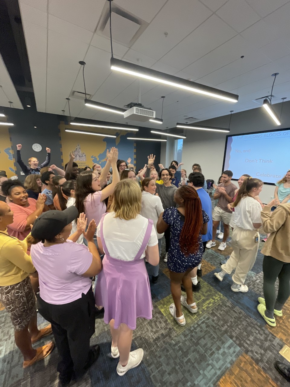 Group of Disney Programs Learning participants clapping after a presentation