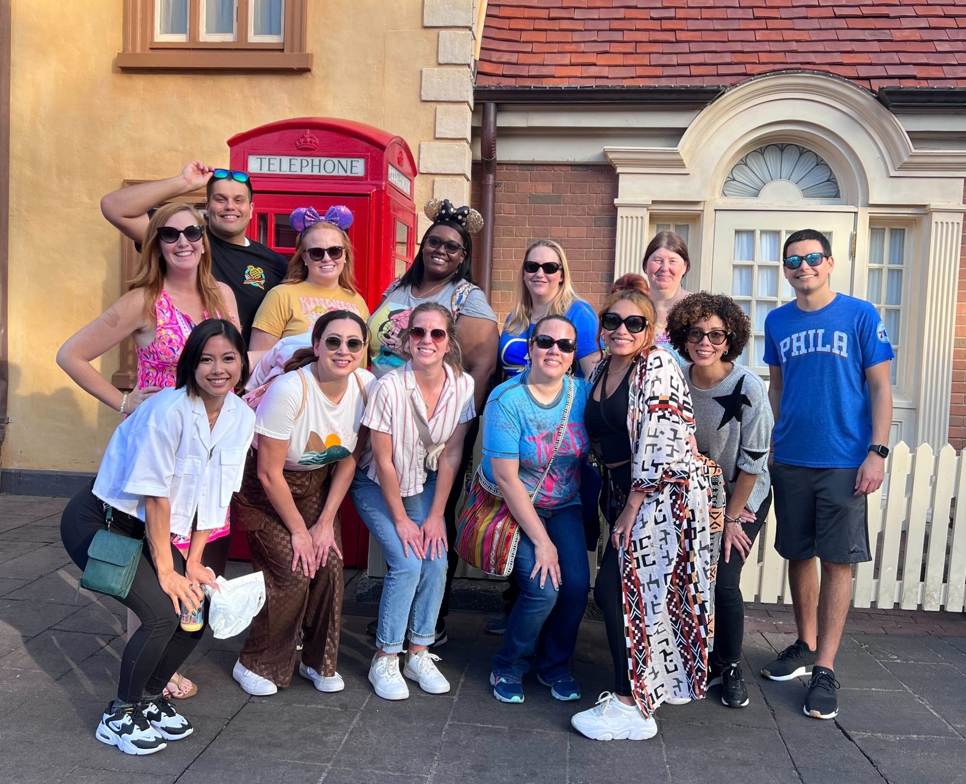 Disney DPEP Technology and Digital EMployee Michelle smiling with a group of her co-workers at a Disney Park