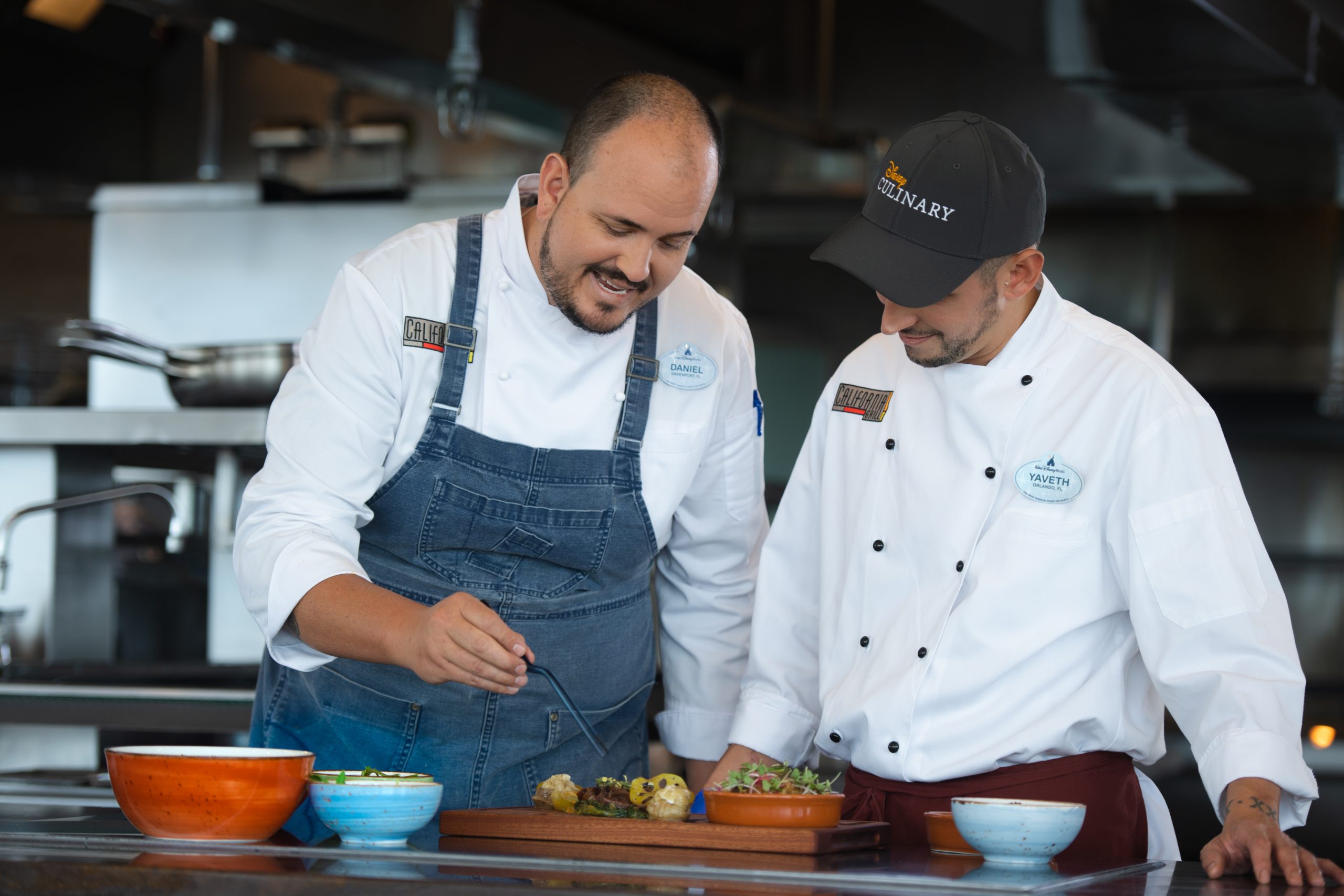 Two Disney Chefs preparing a dish