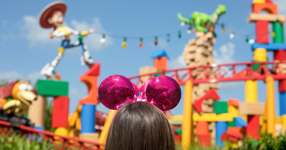 woman in pink Minnie Mouse ears in Toy Story Land at Disney's Hollywood Studios