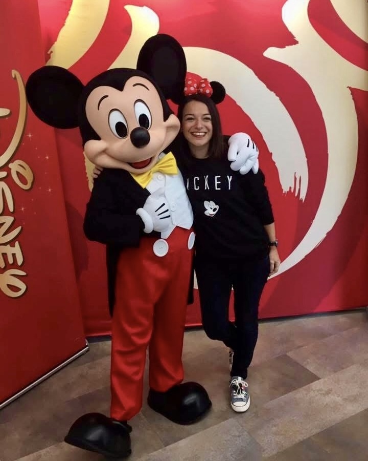 Pinar 02 woman posing with Mickey Mouse