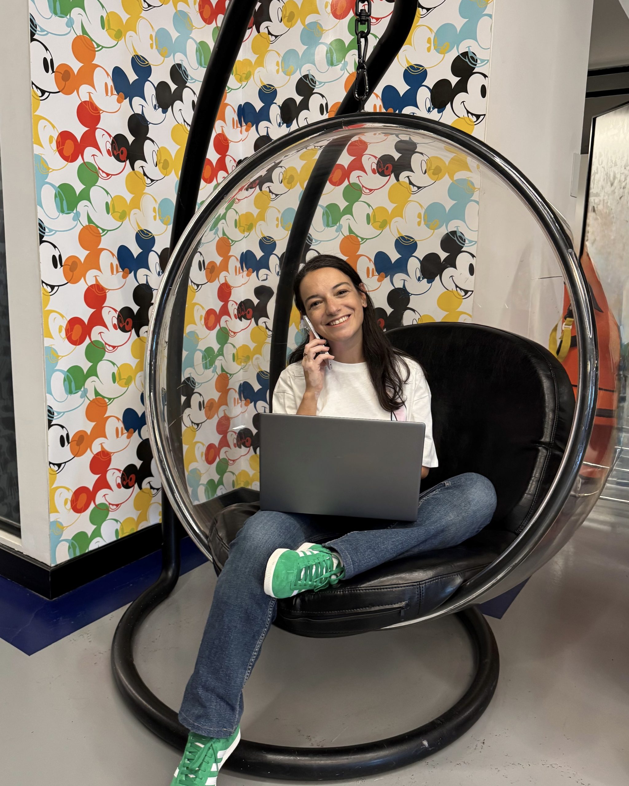 Pinar 03 woman smiling in a chair with a laptop