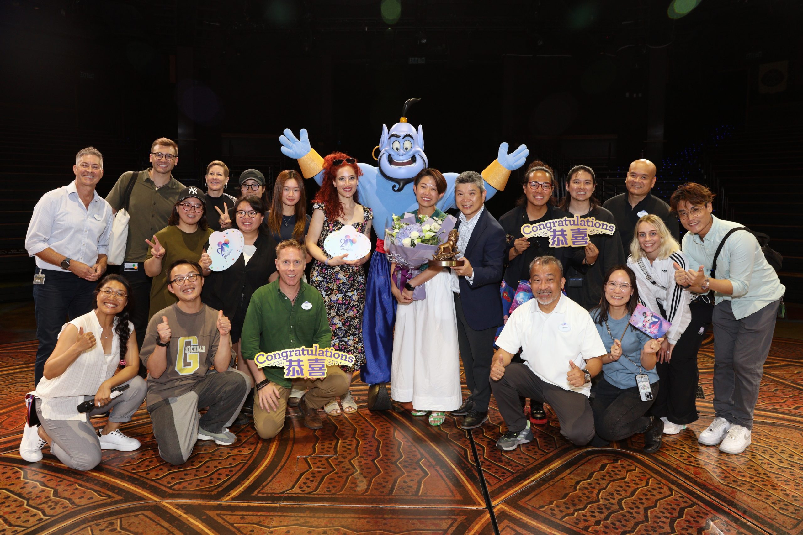 Kitty smiling alongside her fellow cast members — excited for a magical future at Hong Kong Disneyland!
