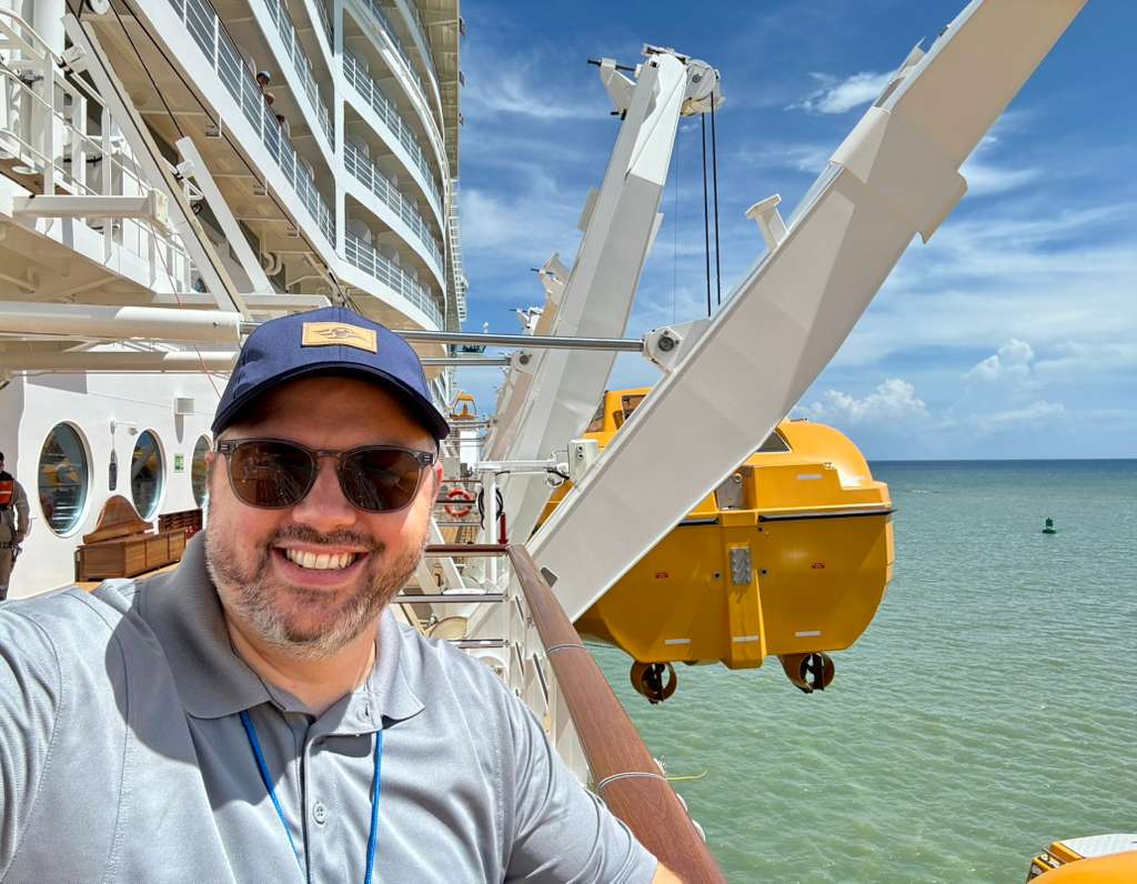 Alex smiles onboard a Disney Cruise ship.