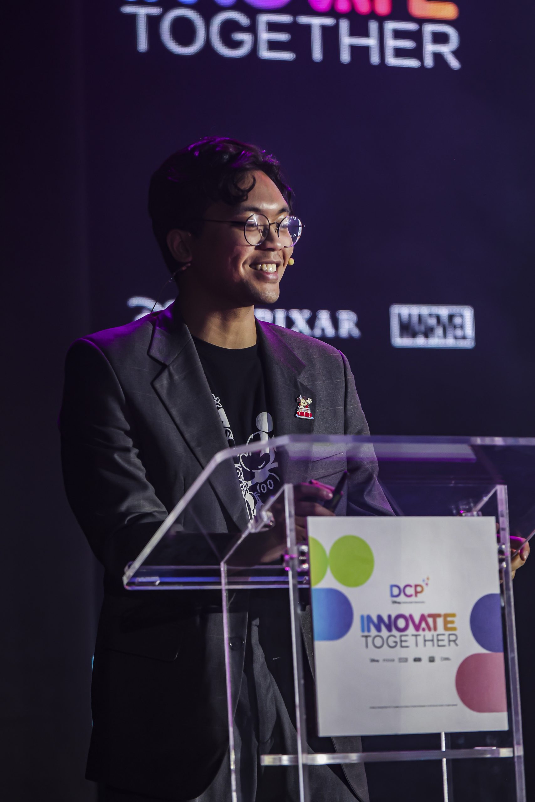 Bryan speaking on stage and DCP Innovate Together