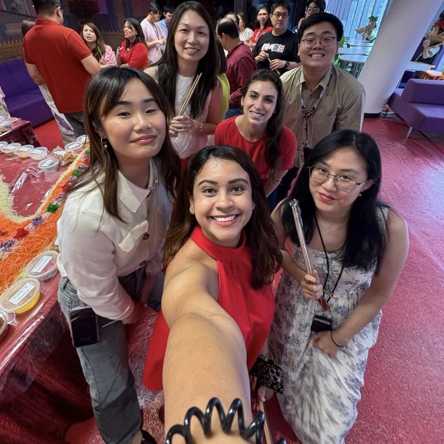 80C312A0-43D4-412C-9B98-B7456230C5A3_1_105_c Group of six people smiling for selfie.