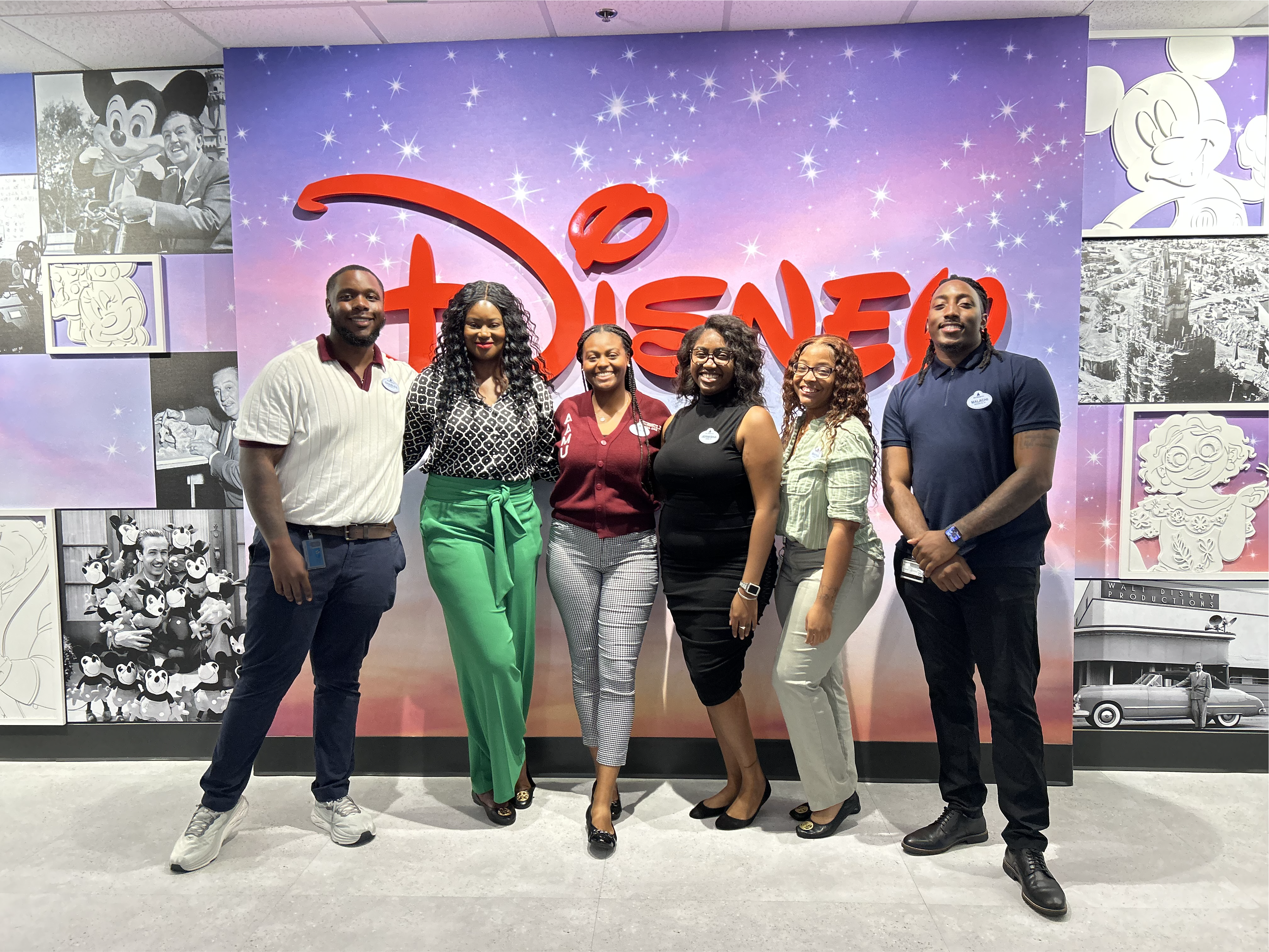 Makyla and colleagues in front of the Disney logo