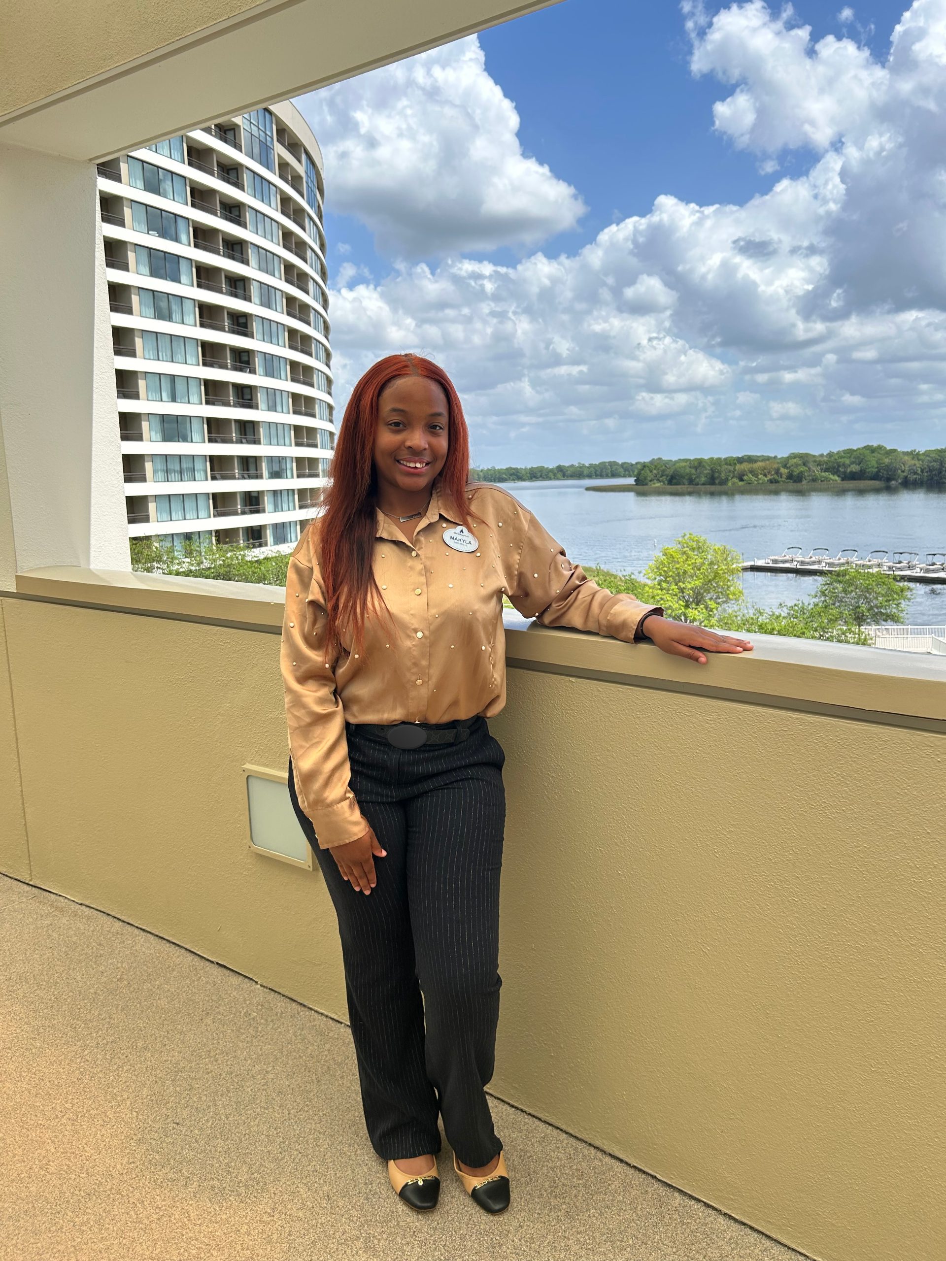 Makyla posing on a balcony