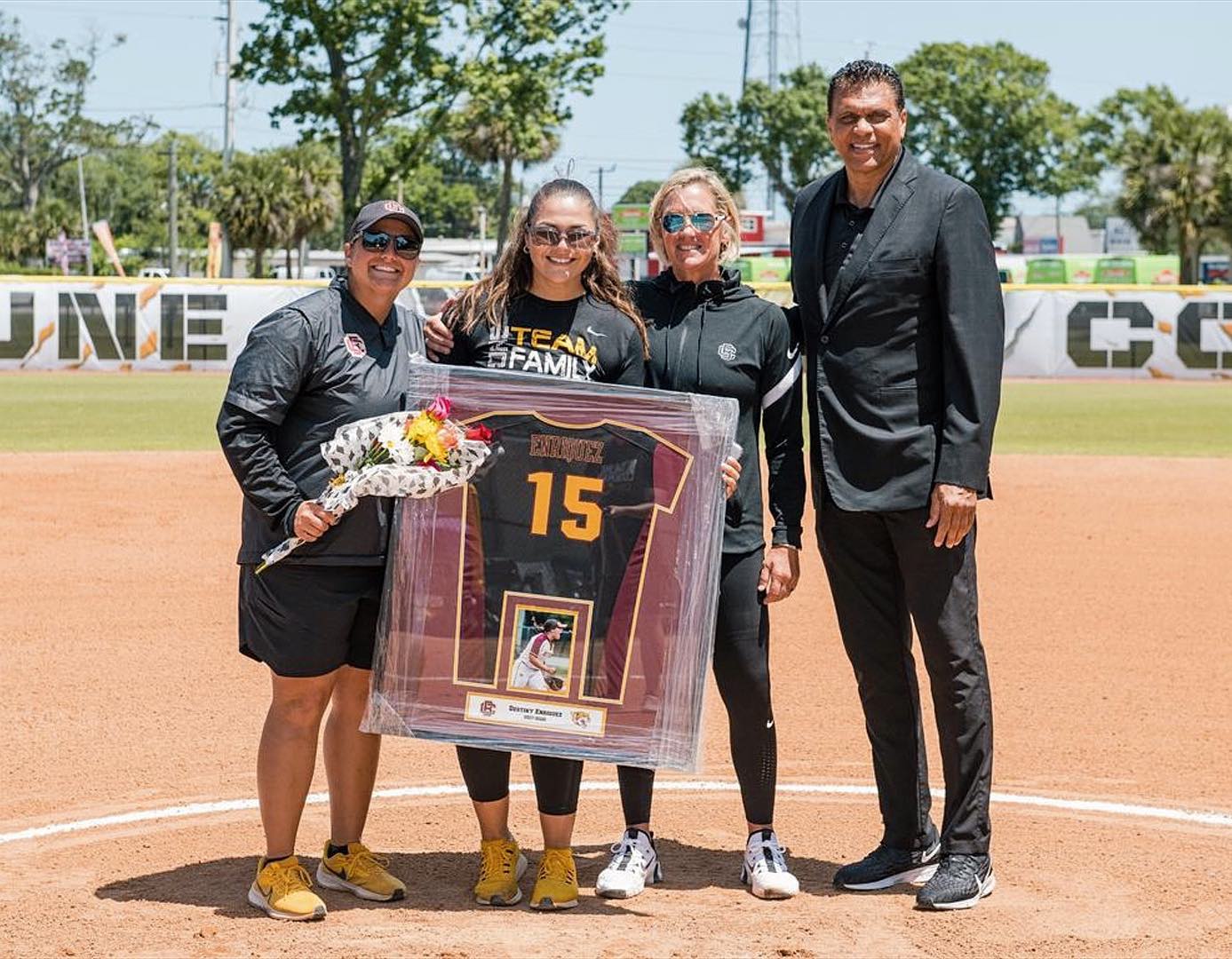 Destiny posing with her family after winning the MEAC Softball Championship