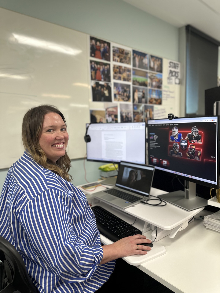Tessa at her desk working on Monday Night Football content.
