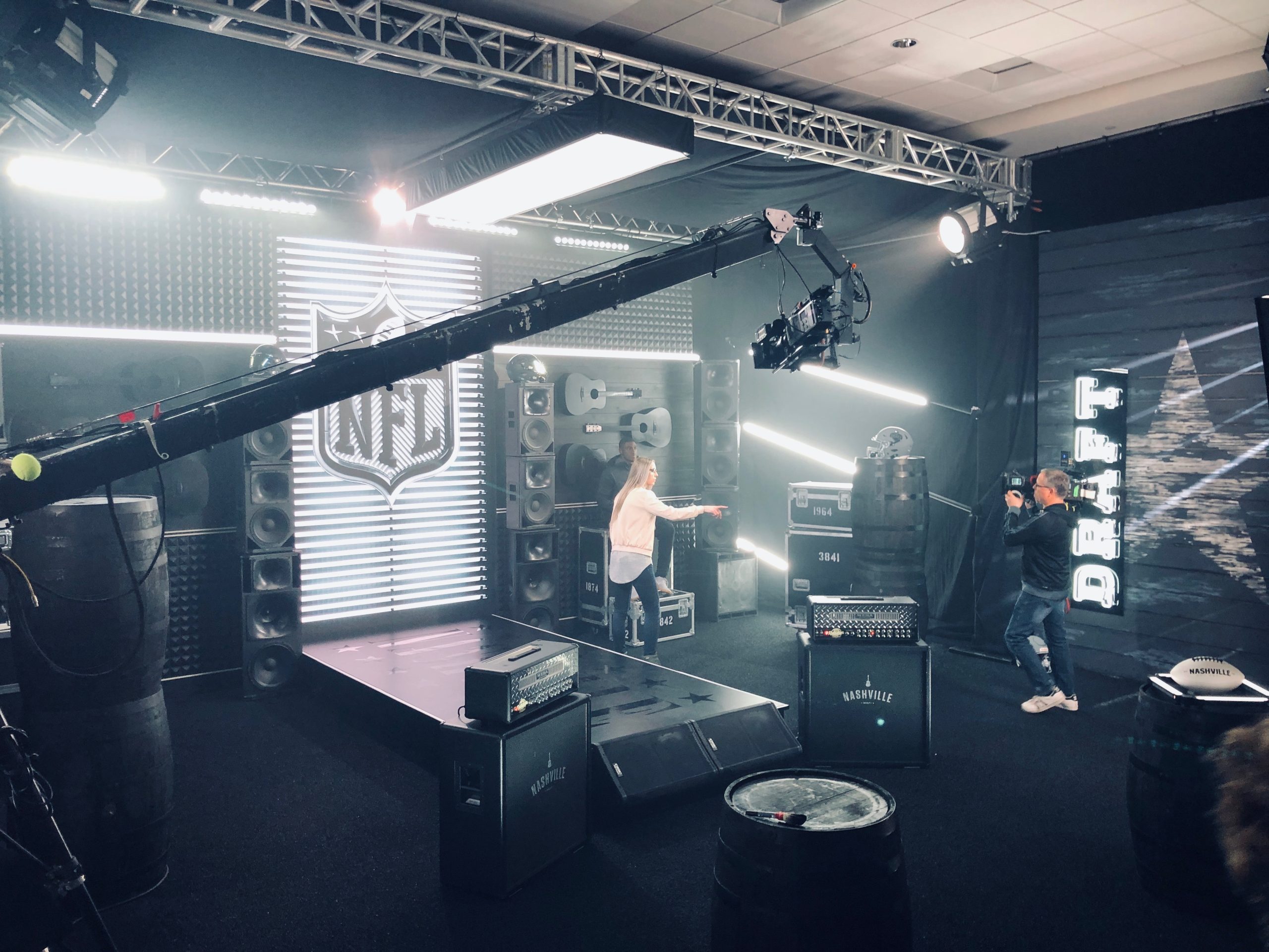 Studio setup with NFL Draft branding, stage lights, and camera crew, demonstrating ESPN’s behind-the-scenes production for major sports events.