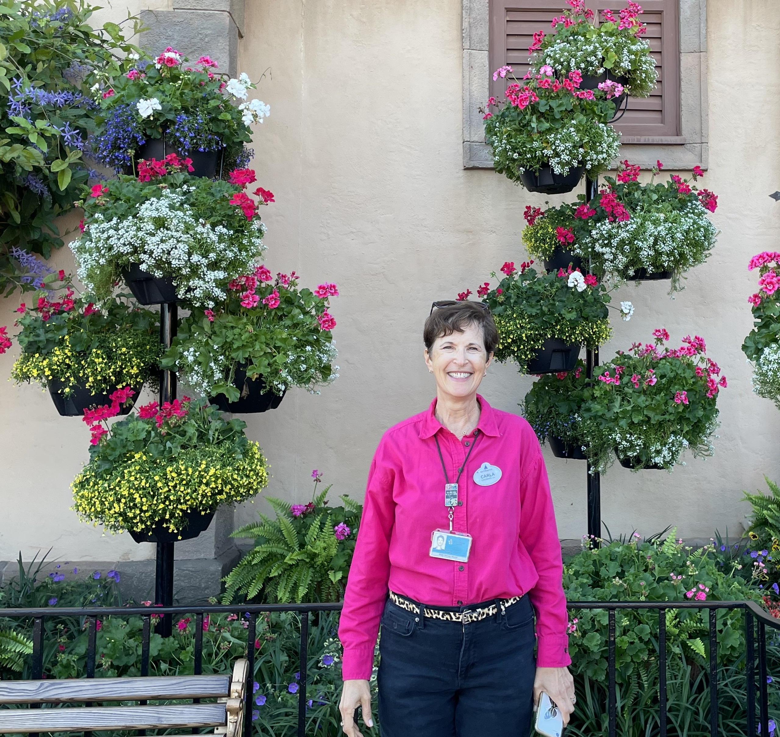 Carla standing in front of beautiful planters.
