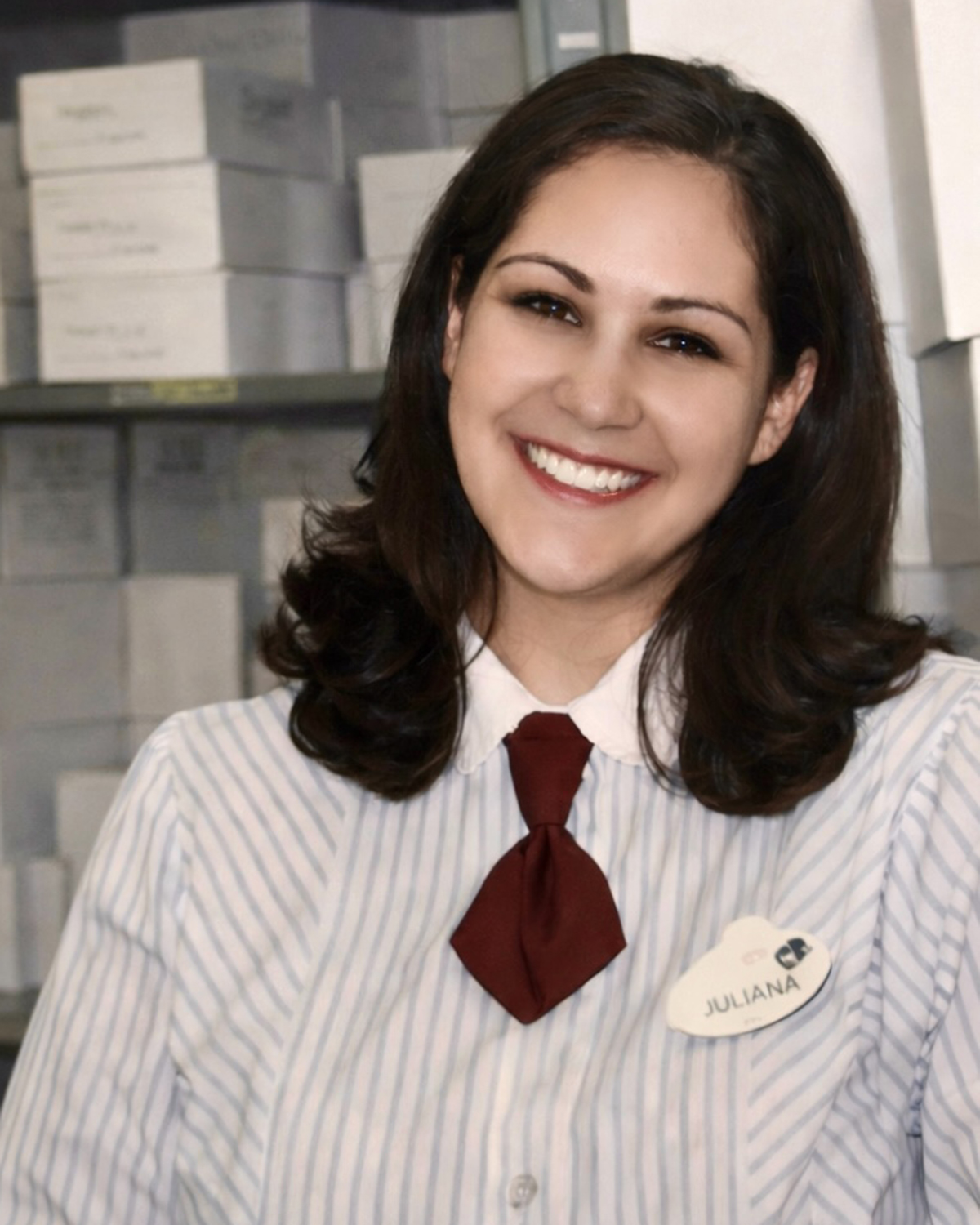 Early‑career Disney cast member in a work setting, illustrating professional growth and training opportunities at Disneyland Resort.