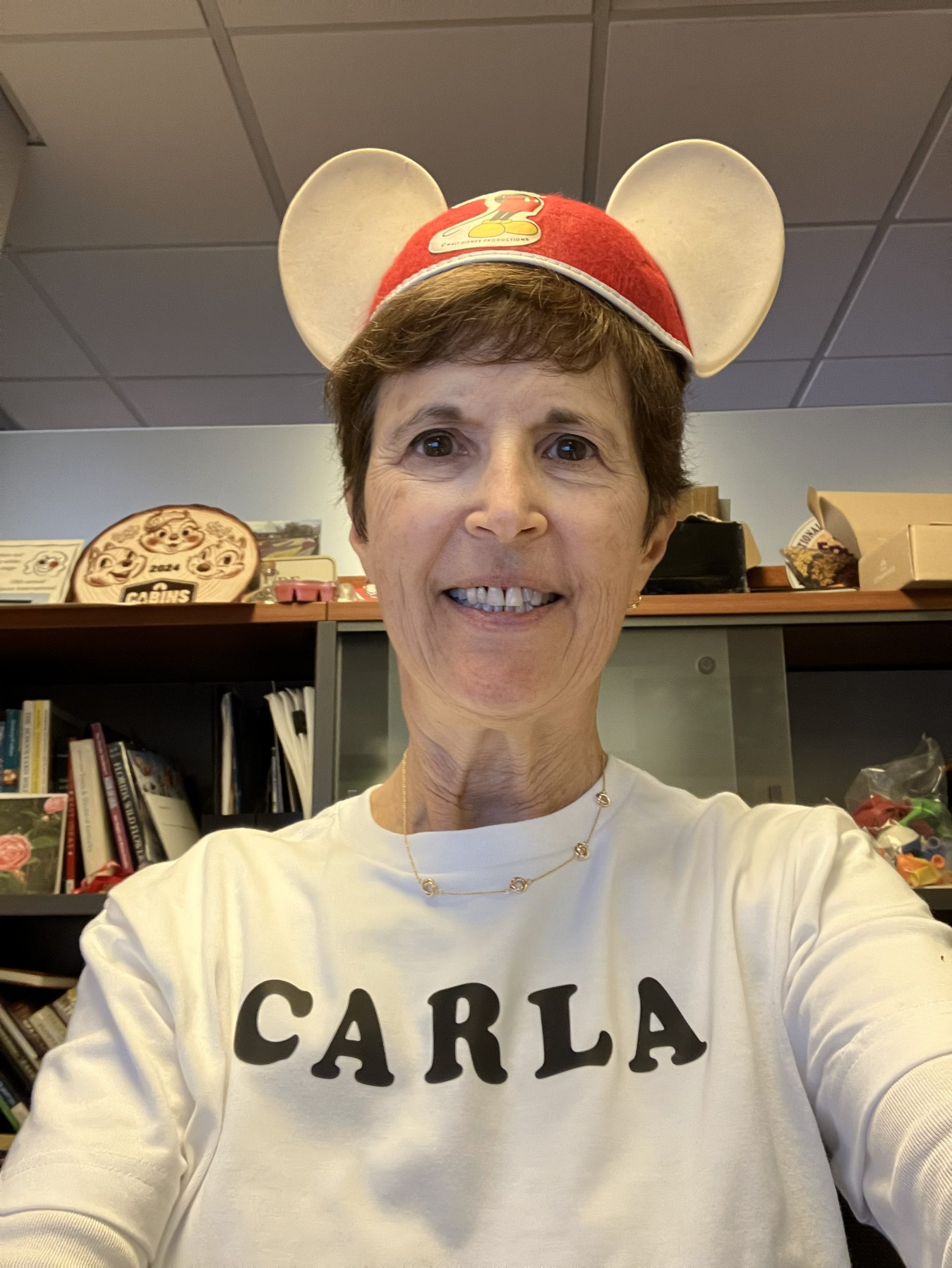 Carla wearing cute Mickey ear hat.