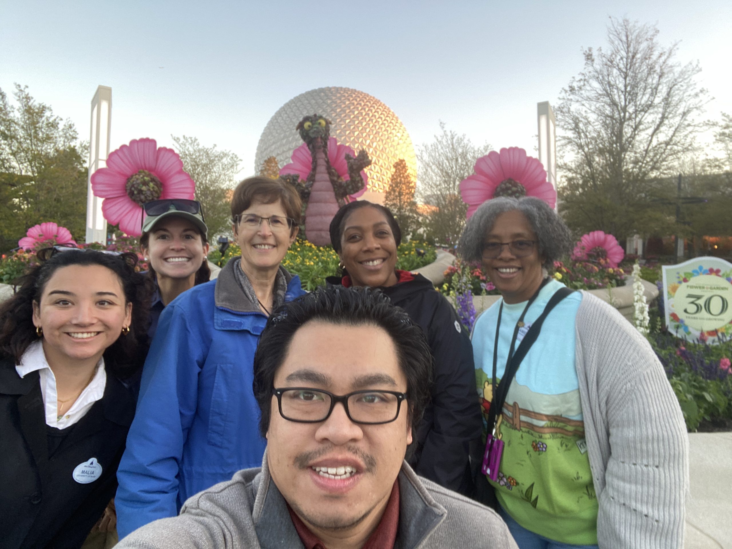 Carla and her team at EPCOT in front of Spaceship Earth.
