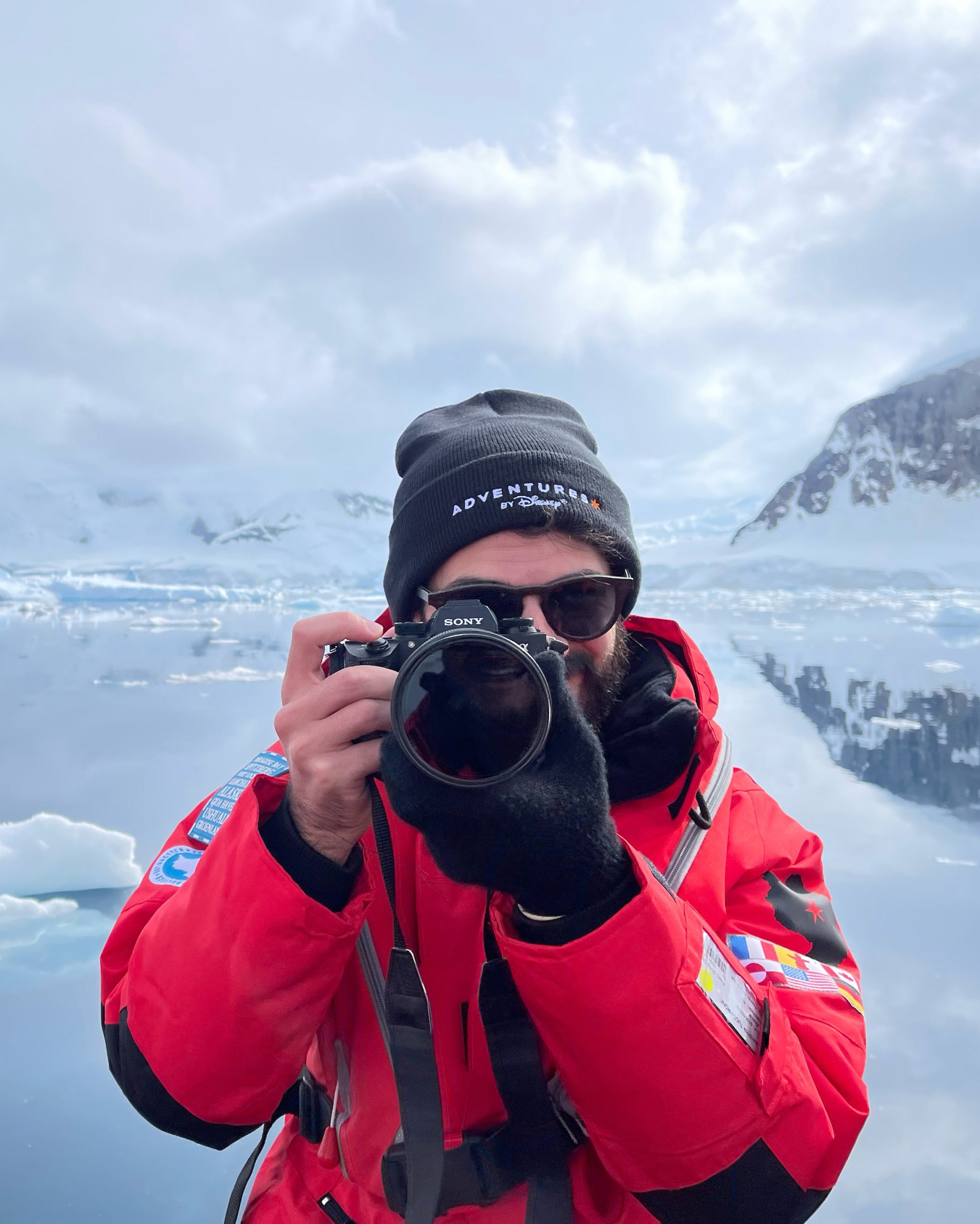 Social media creator capturing visual content in an outdoor environment, reflecting Disney&rsquo;s emphasis on authentic storytelling and creative exploration.