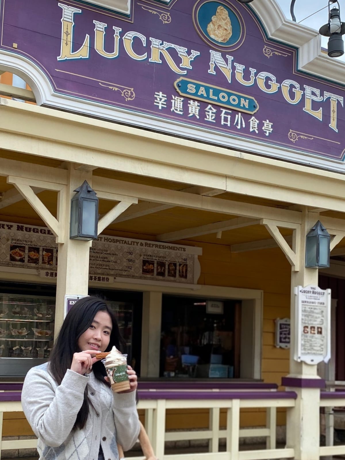 Noelle in front of the Lucky Nugget with ice cream.