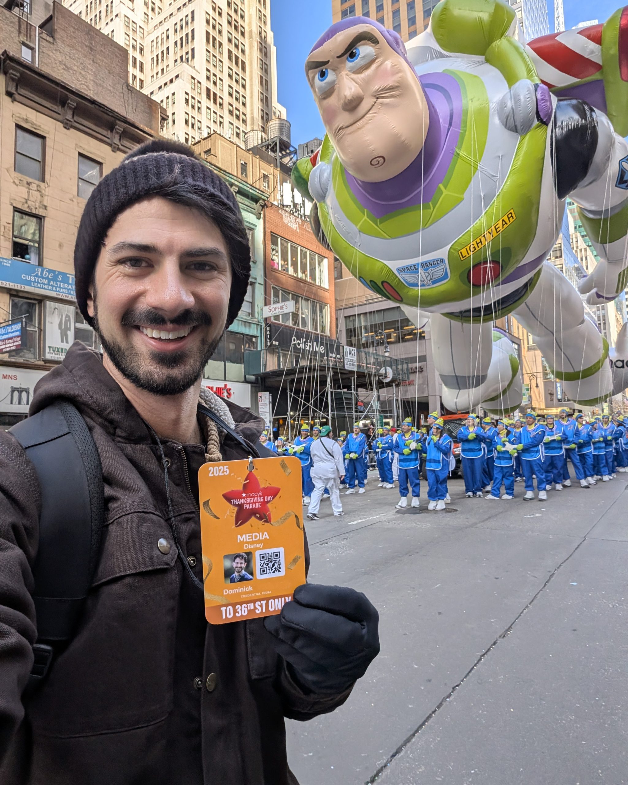 Live event content creation featuring a Buzz Lightyear parade balloon, illustrating viral social storytelling from Disney Parks and large‑scale brand moments.