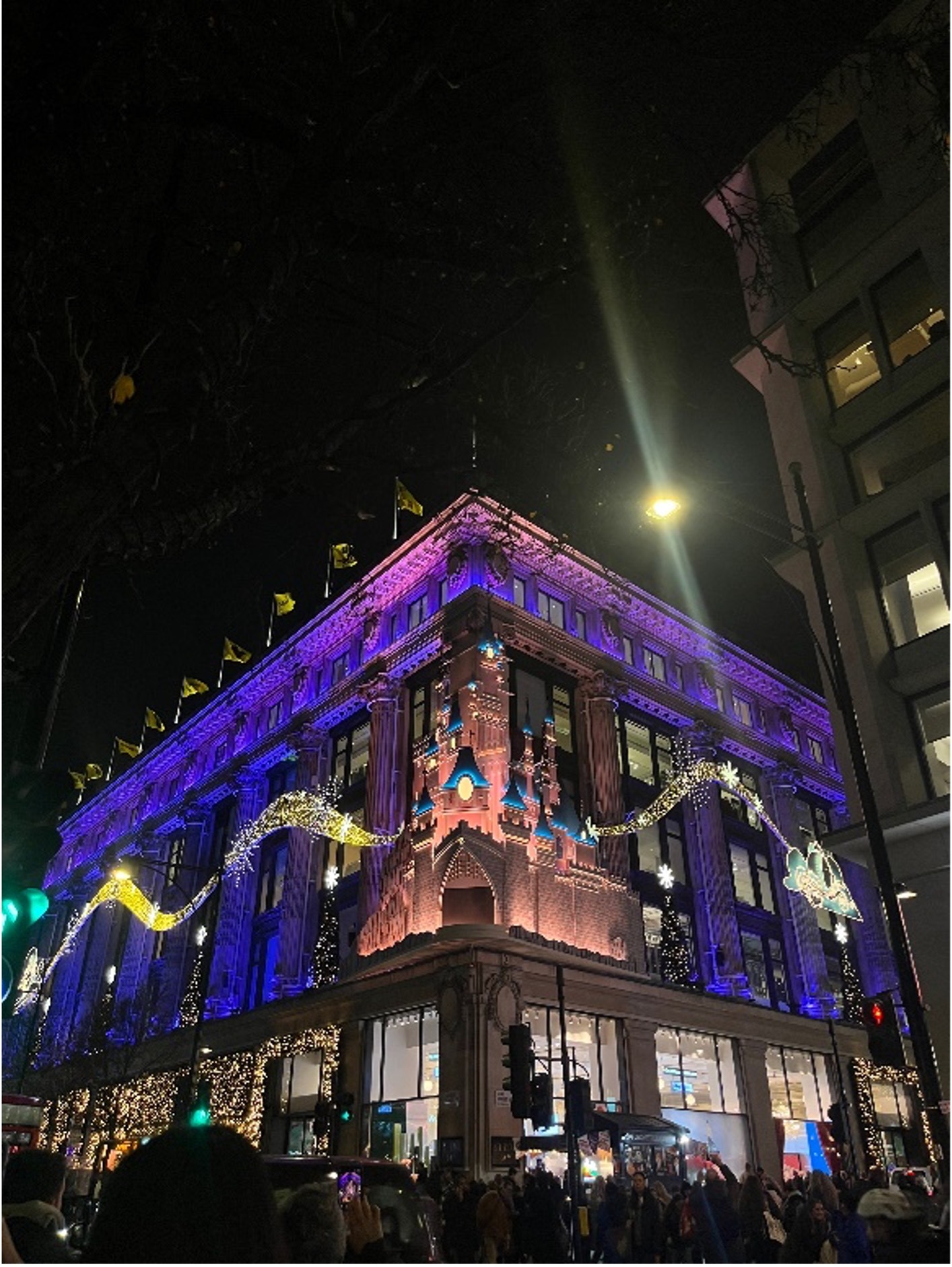 Exterior of Selfridges department store illuminated with Disney-themed lighting during the Disney x Selfridges collaboration in London.