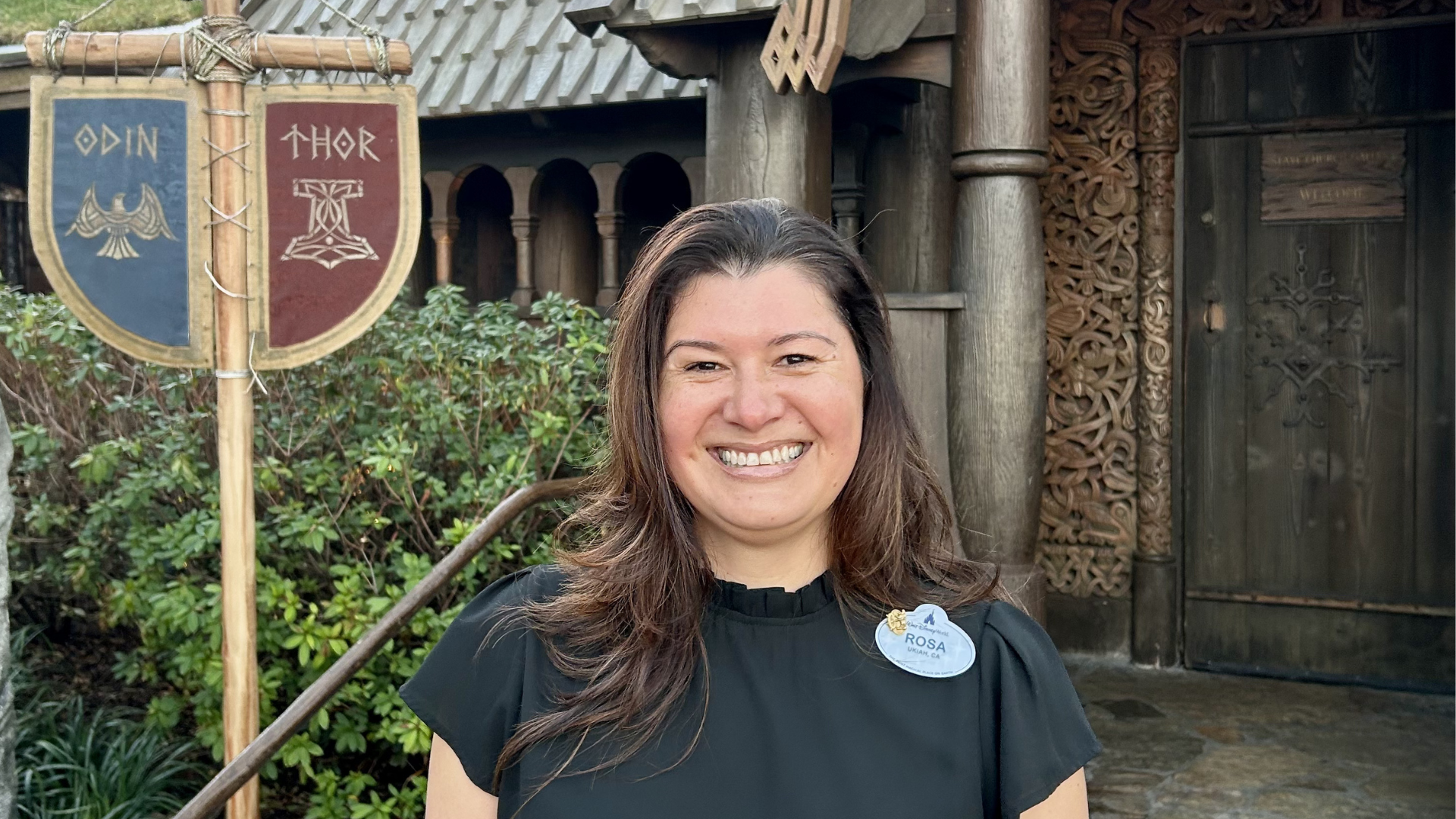 Rosa posing in front of Norway pavilion at EPCOT